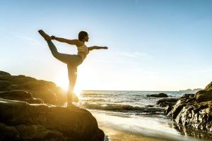 women learning the health benefits of yoga