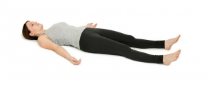 women laying on white background showing yoga pose