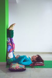 women using the wall to help her stretch