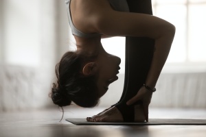 women doing a folded yin yoga pose