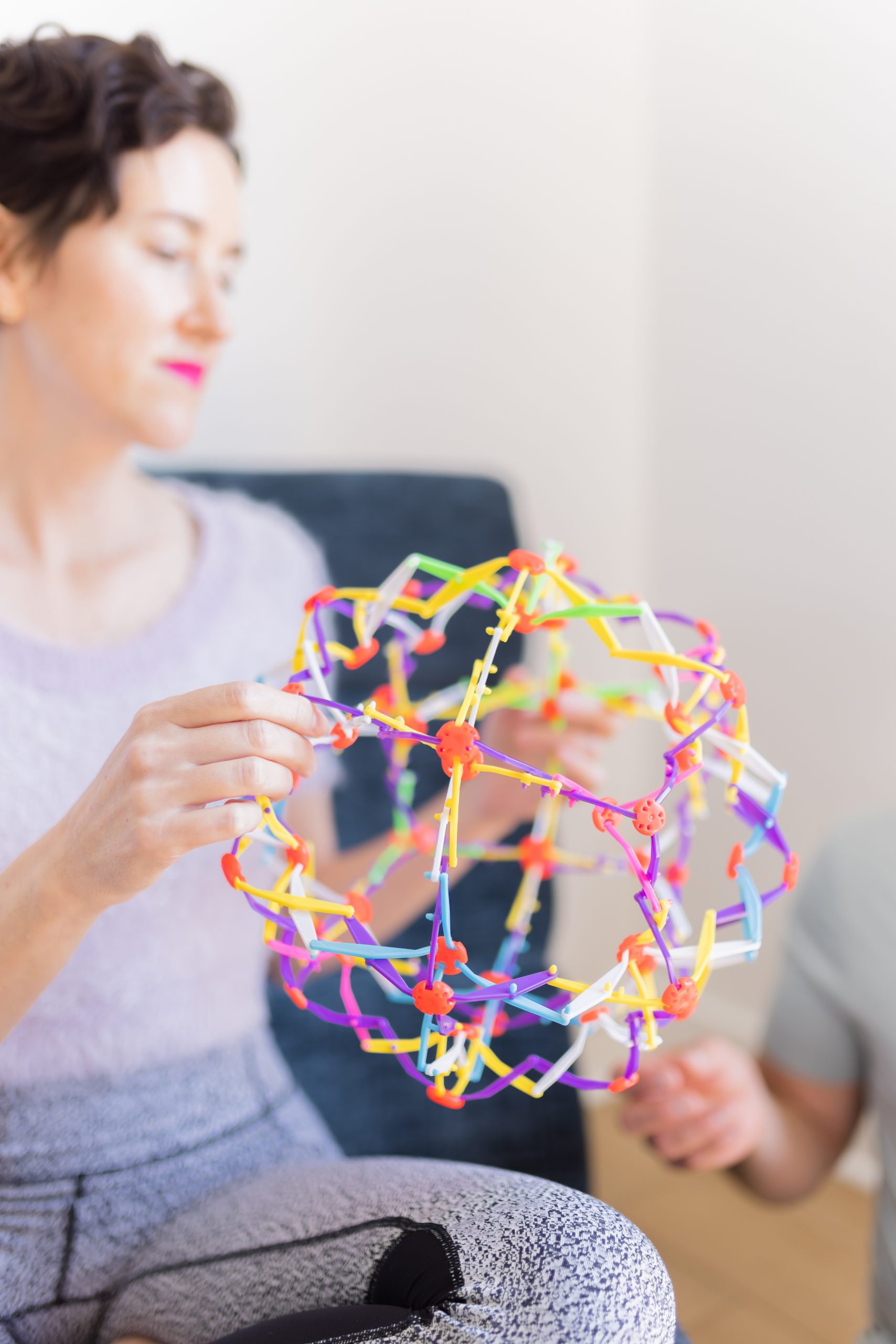 Woman holding an expanding children's ball