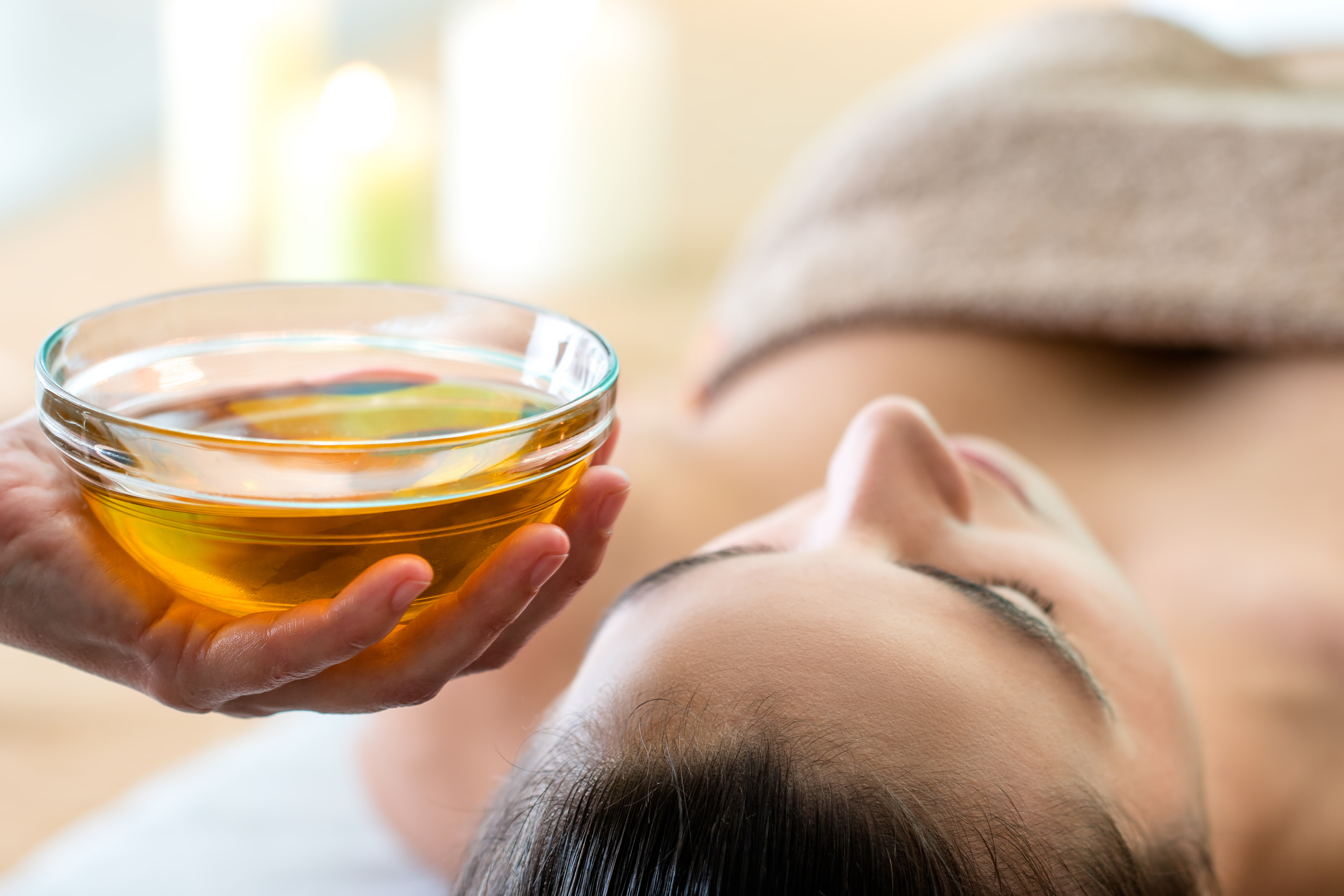 Woman getting an abhyanga massage