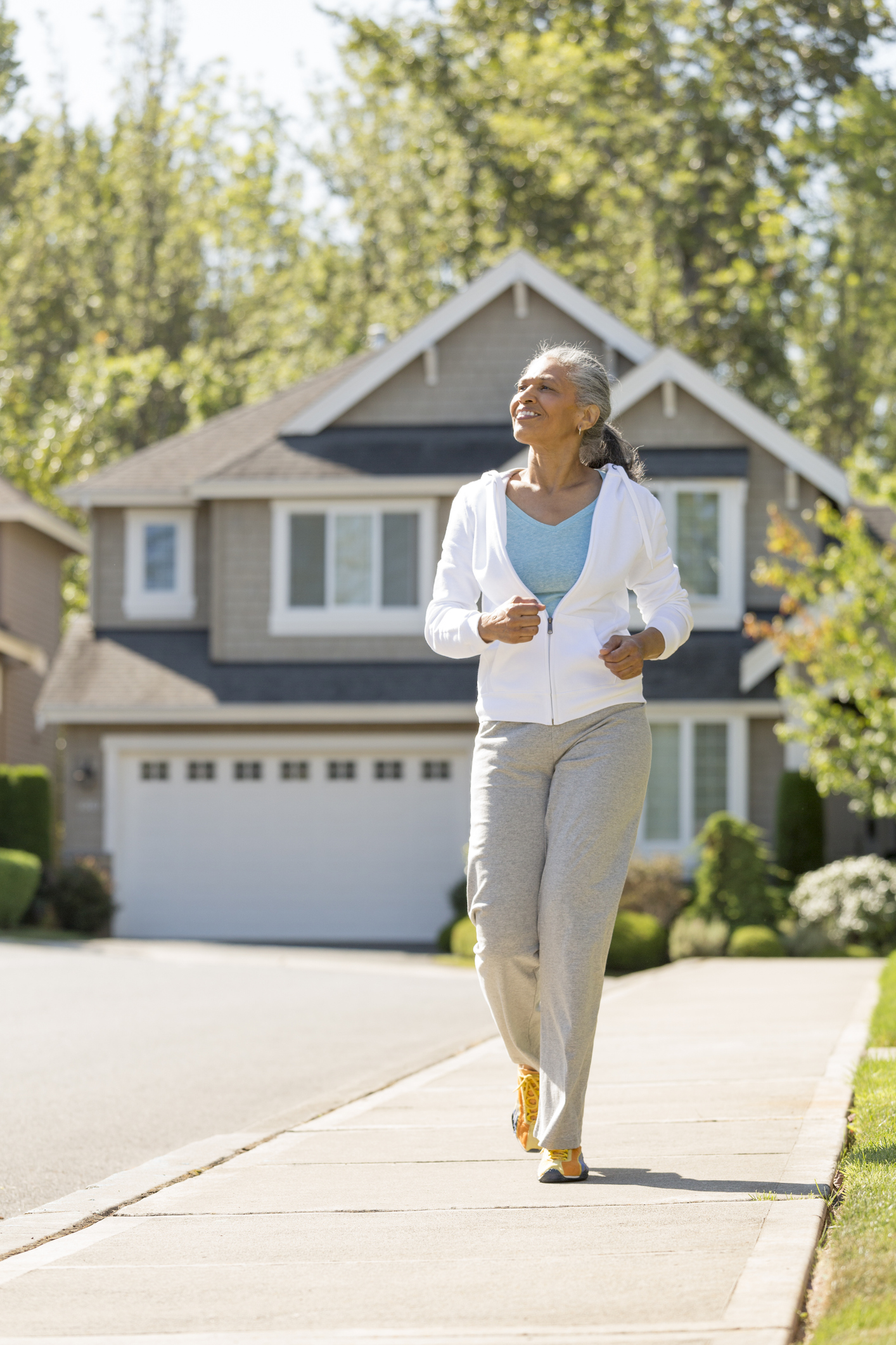 Woman walking in the neighborhood