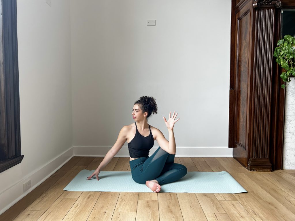 Girl in Ardha Matsyendrāsana