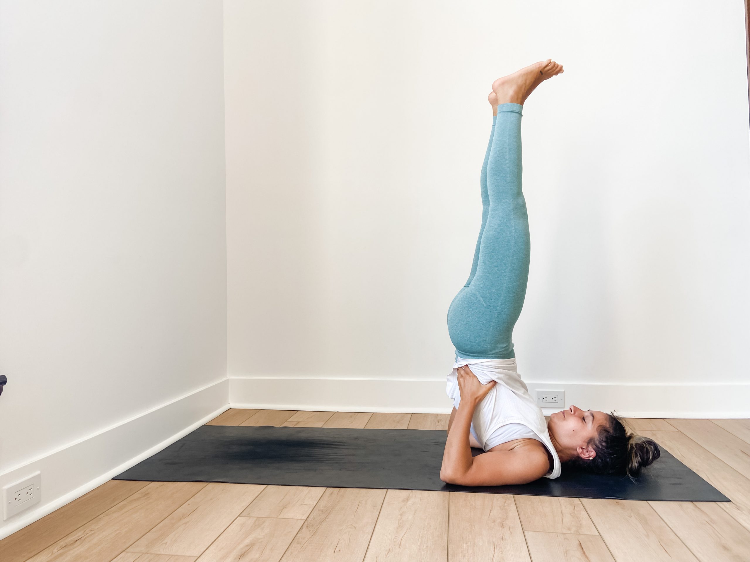 Girl in shoulder stand