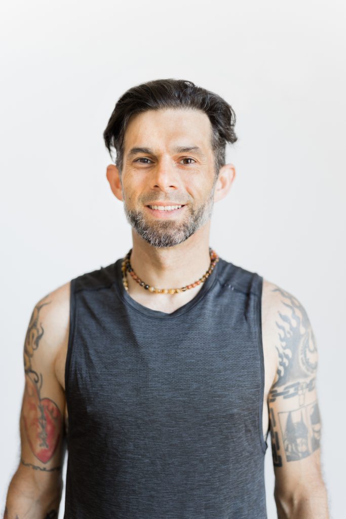 Ronen in a gray tanktop, smiling