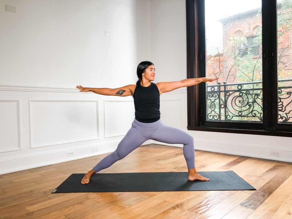 Warrior Two Pose on a yoga mat