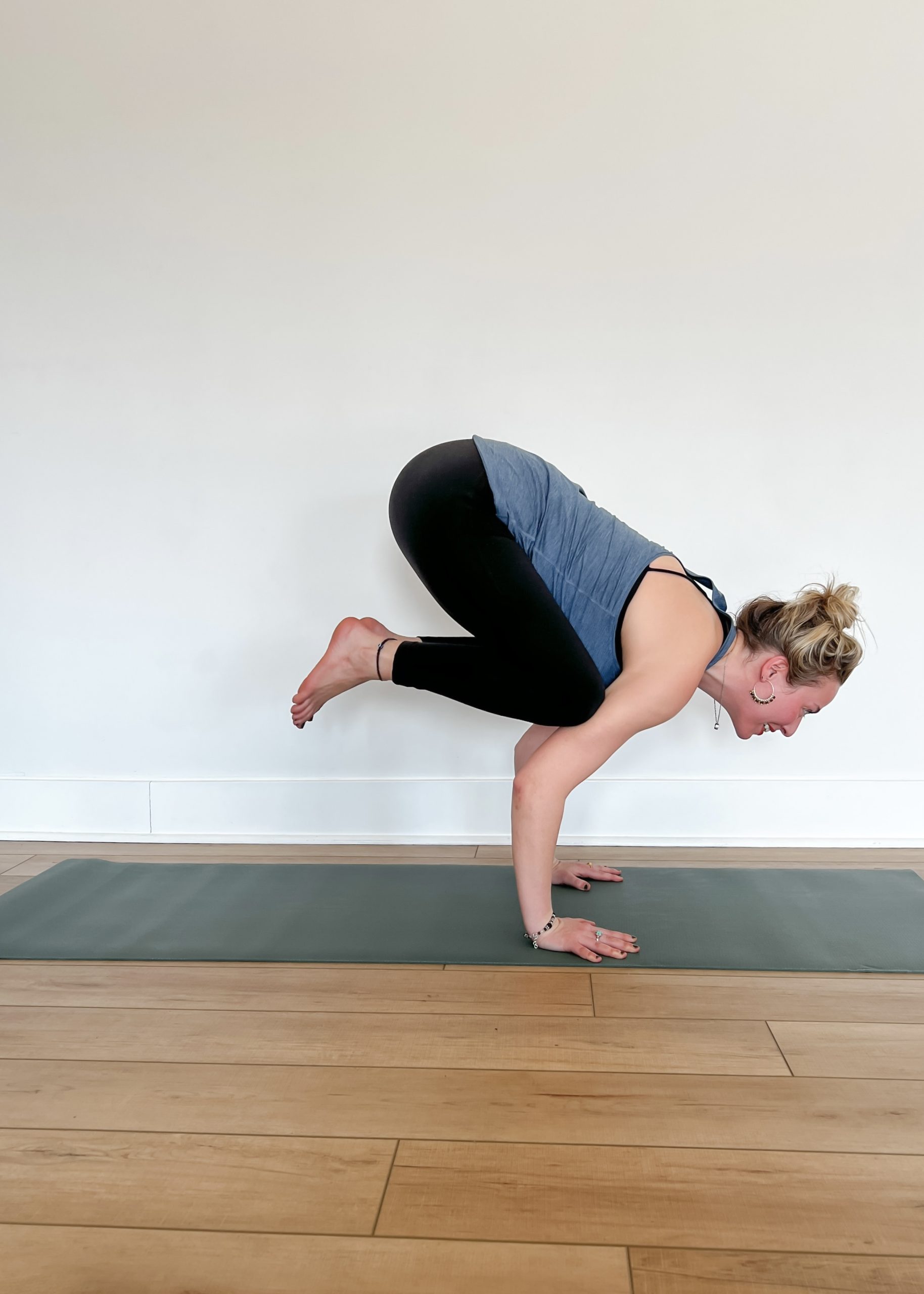 Person in Crow Pose or Bakasana