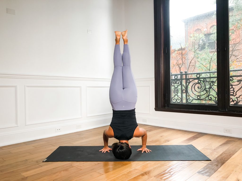 Girl in tripod headstand pose